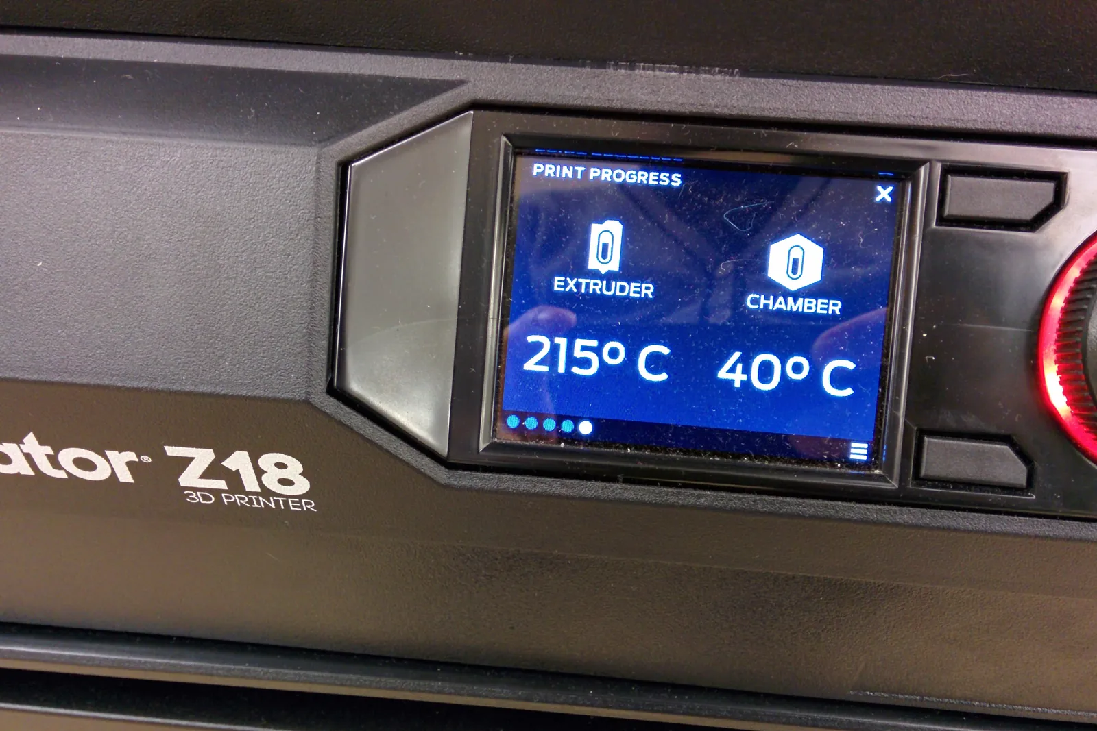 A printer status screen reading 215 degrees at the extruder and 40 degrees in the chamber