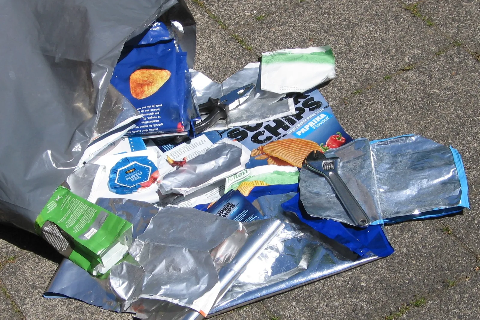 Used crisp and snack packets made of metallised plastic and aluminium laminate