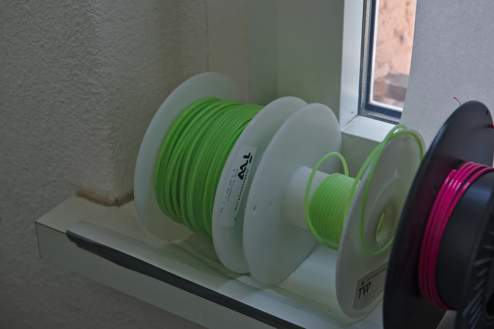 Filament spools on a window sill